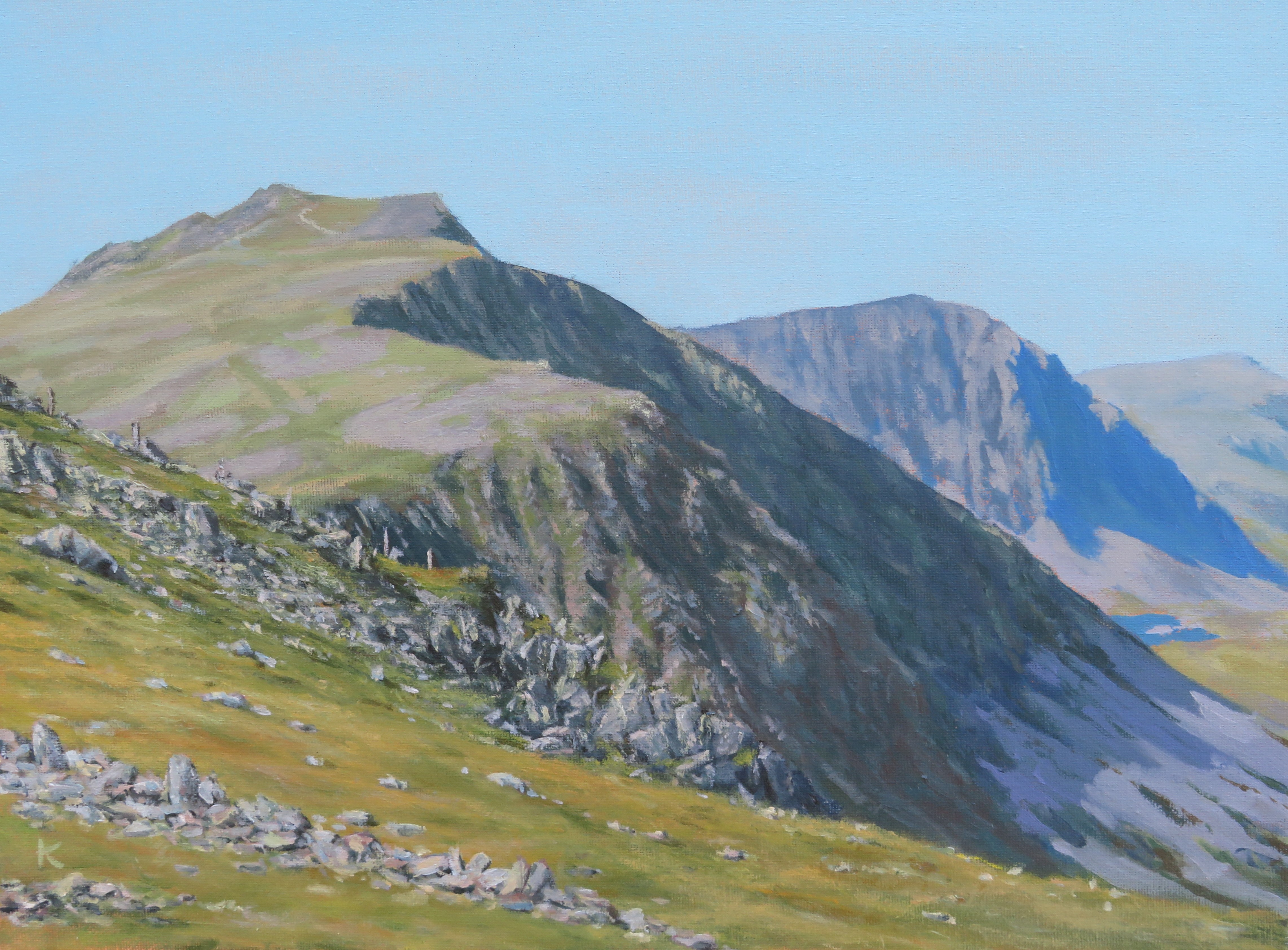 Cader Idris, a rocky meadow, looking west towards the sea on a fine day
